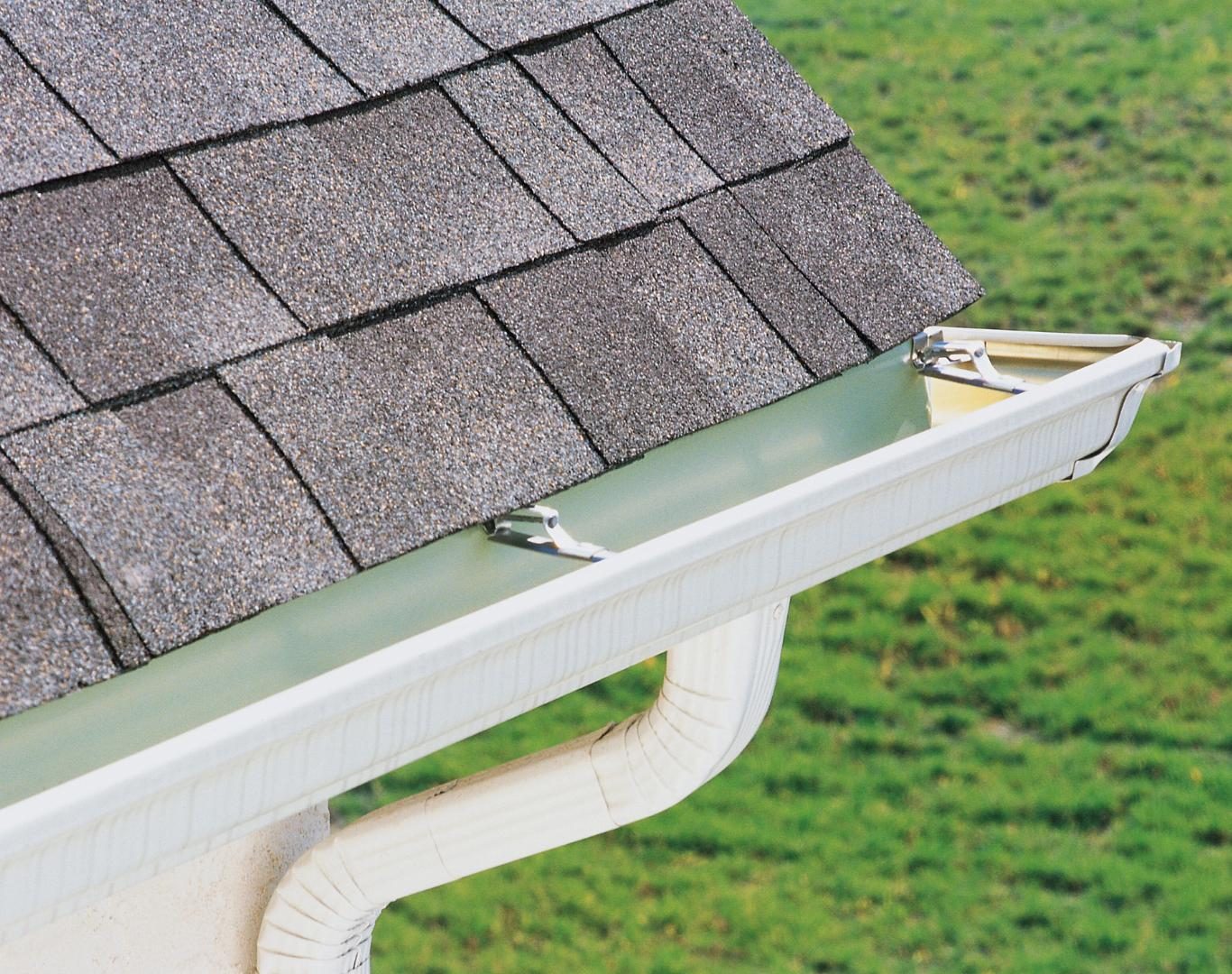 Expert gutter installer near me in Weedsport, NY fitting new downspouts