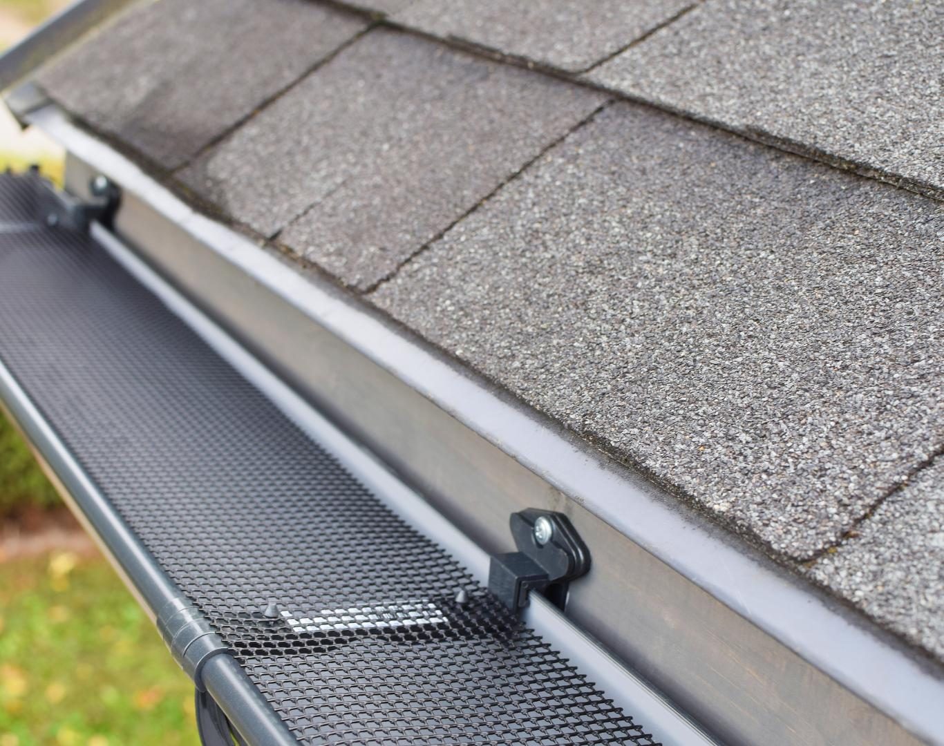 Gutter installer near me in Sennett, NY preparing downspout fittings