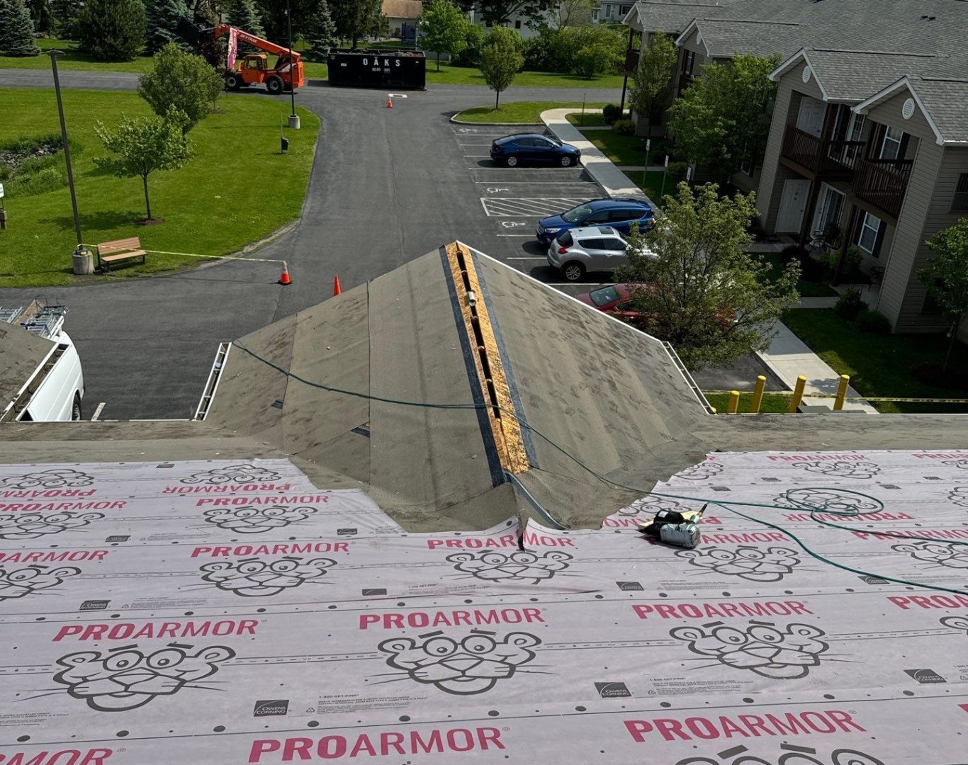 Aerial shot of a house under construction in Clonmel, Ireland. Workers on the roof.
